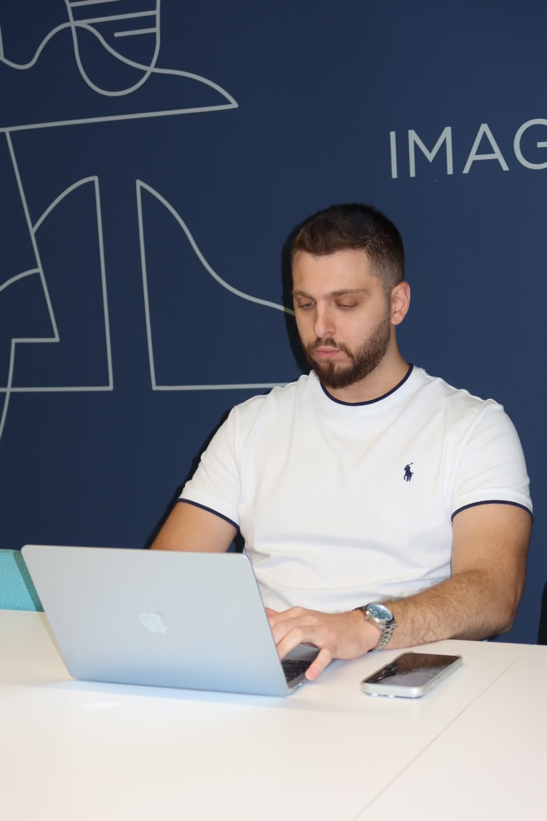 An OWS developer working on a laptop